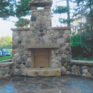 Fieldstone Fireplace on Southern Sandstone flagstone patio installed by Stum Masonry