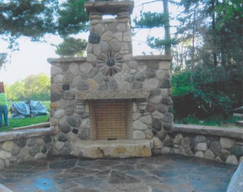 Fieldstone Fireplace on Southern Sandstone flagstone patio installed  by Stum Masonry